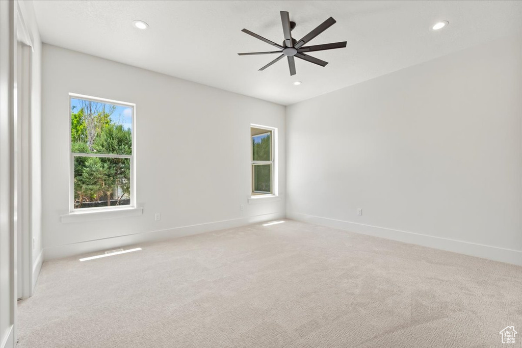 Unfurnished room with light carpet, recessed lighting, baseboards, and ceiling fan