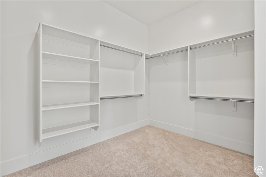 Spacious closet with carpet floors