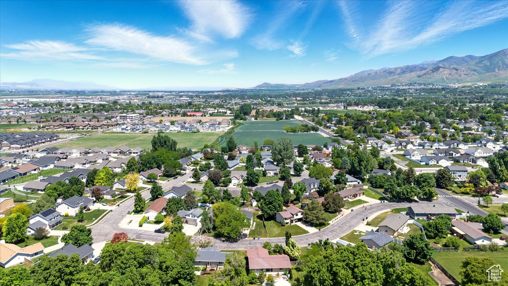 View of property location featuring a mountain backdrop and nearby suburban area