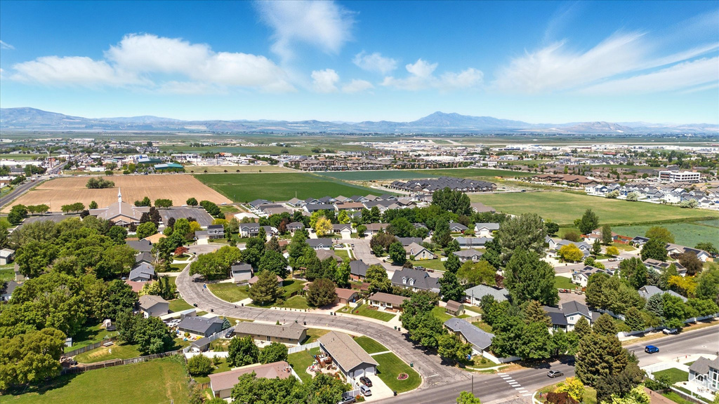 Aerial perspective of suburban area with a mountainous background