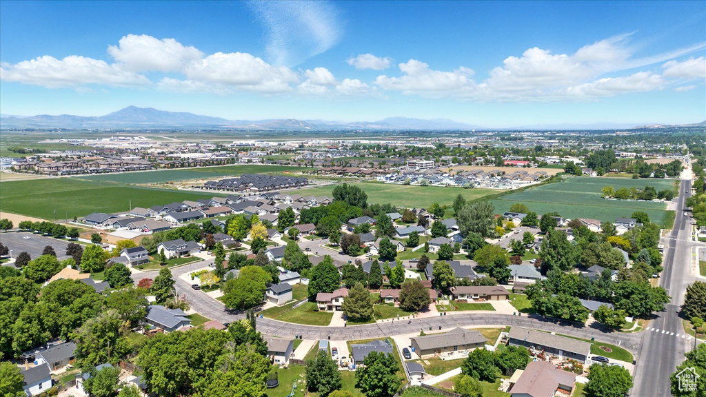Aerial perspective of suburban area with a mountain backdrop