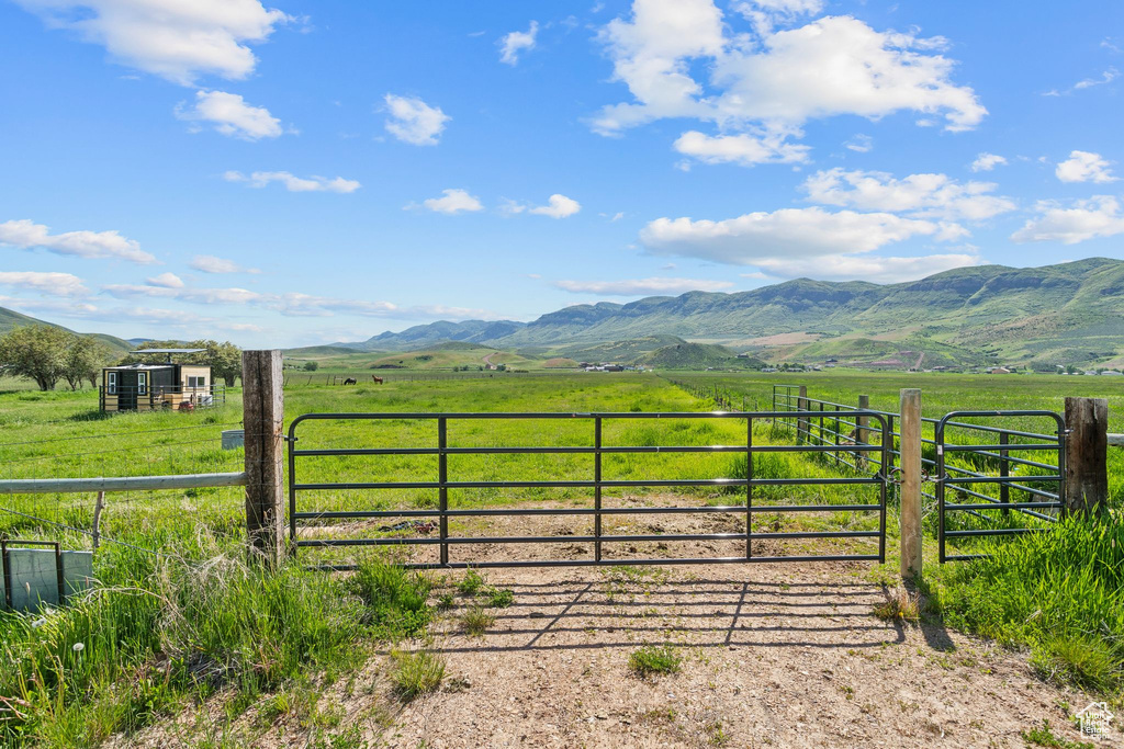 View of mountain background featuring rural landscape and agricultural land
