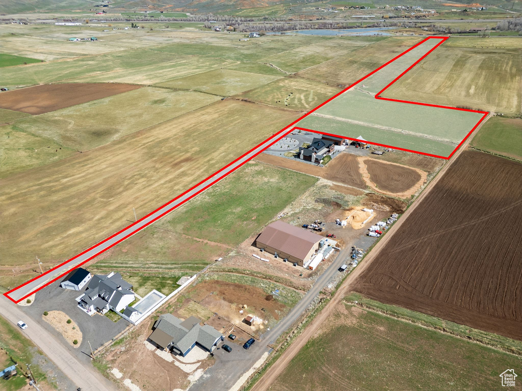 Aerial view of property and surrounding area featuring property parcel outlined
