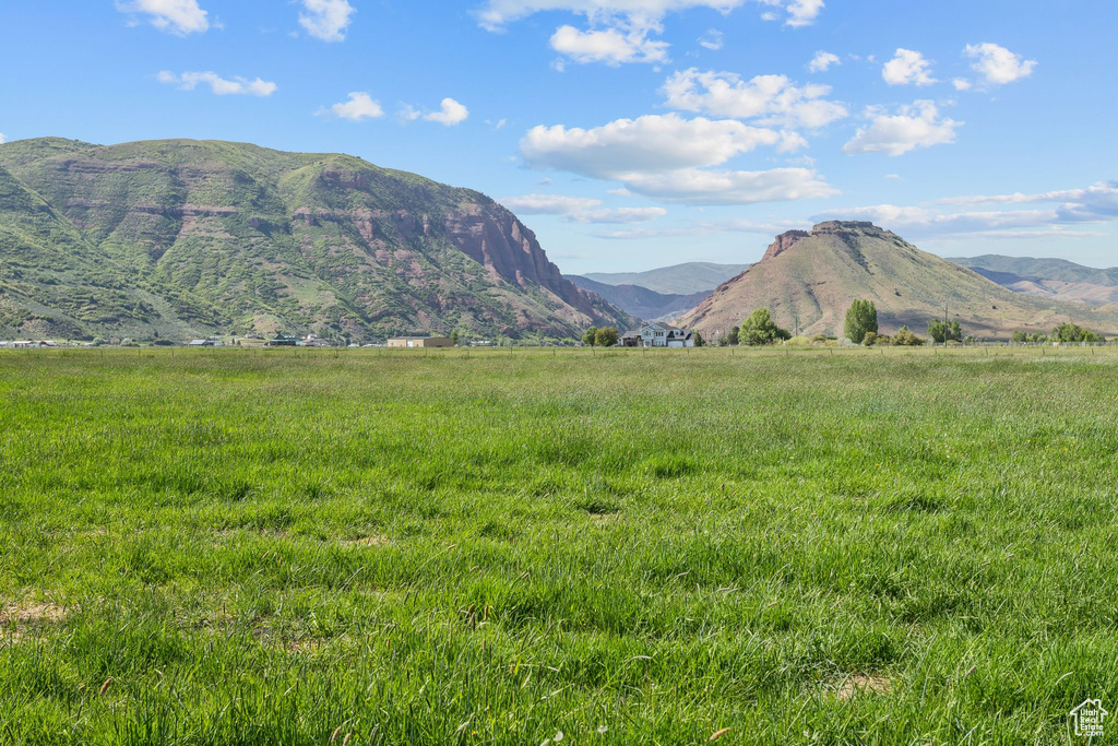 View of mountain background featuring rural landscape