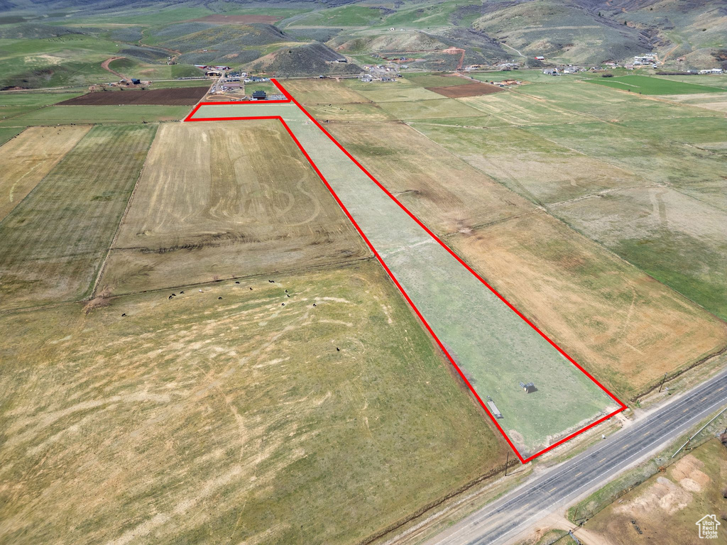 Aerial view of sparsely populated area with property boundaries highlighted