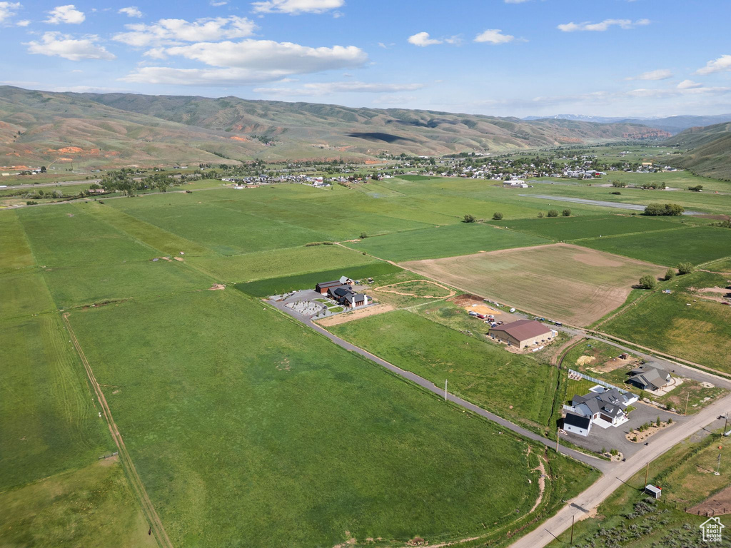 Aerial view of property\'s location featuring rural landscape and a mountain backdrop