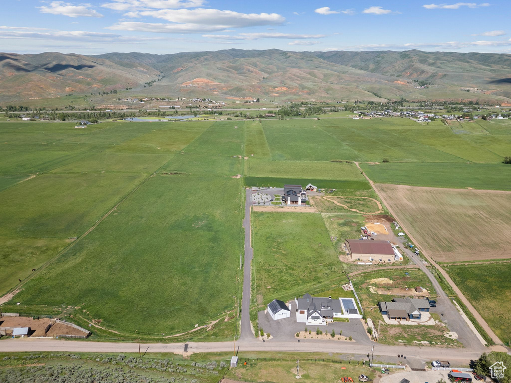 Aerial overview of property\'s location with rural landscape and a mountain backdrop