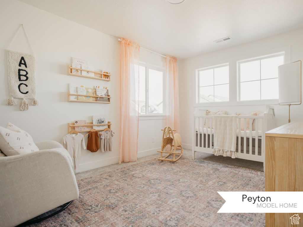 Bedroom with baseboards and visible vents