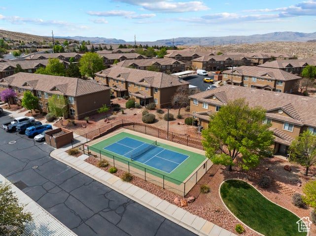 Aerial view of residential area featuring a mountainous background