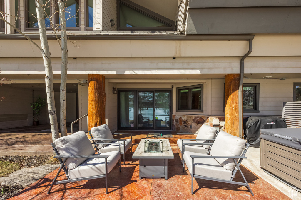 View of patio / terrace with a grill and an outdoor living space with a fire pit
