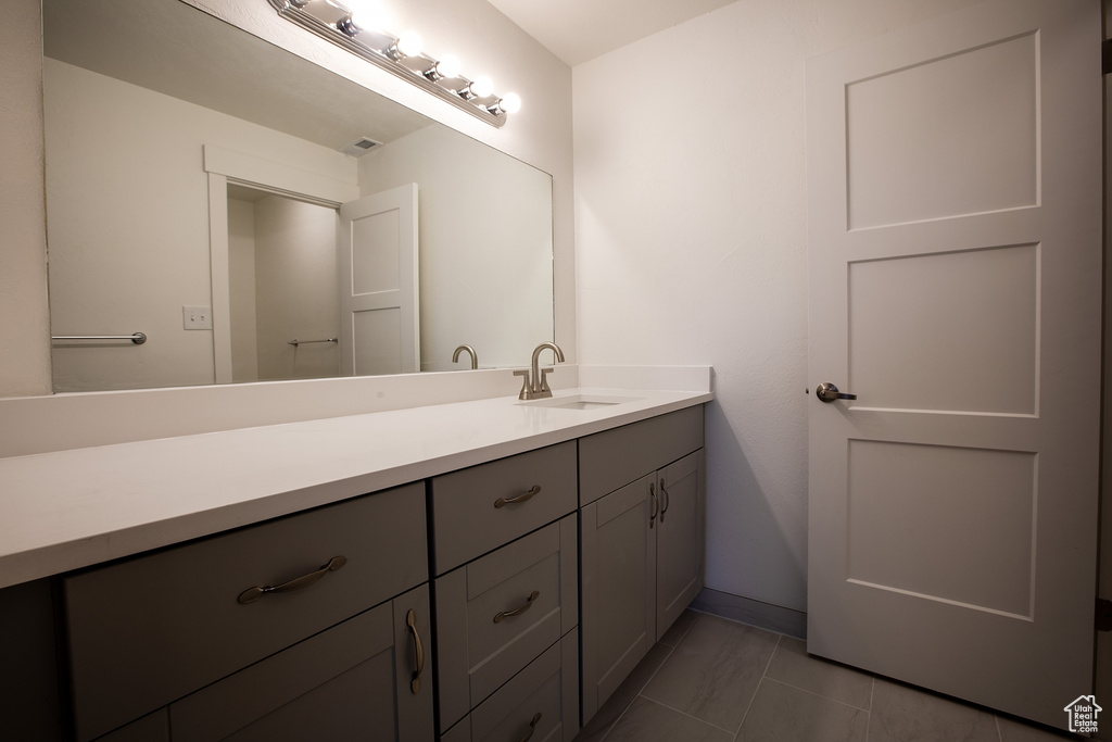 Bathroom with vanity and baseboards