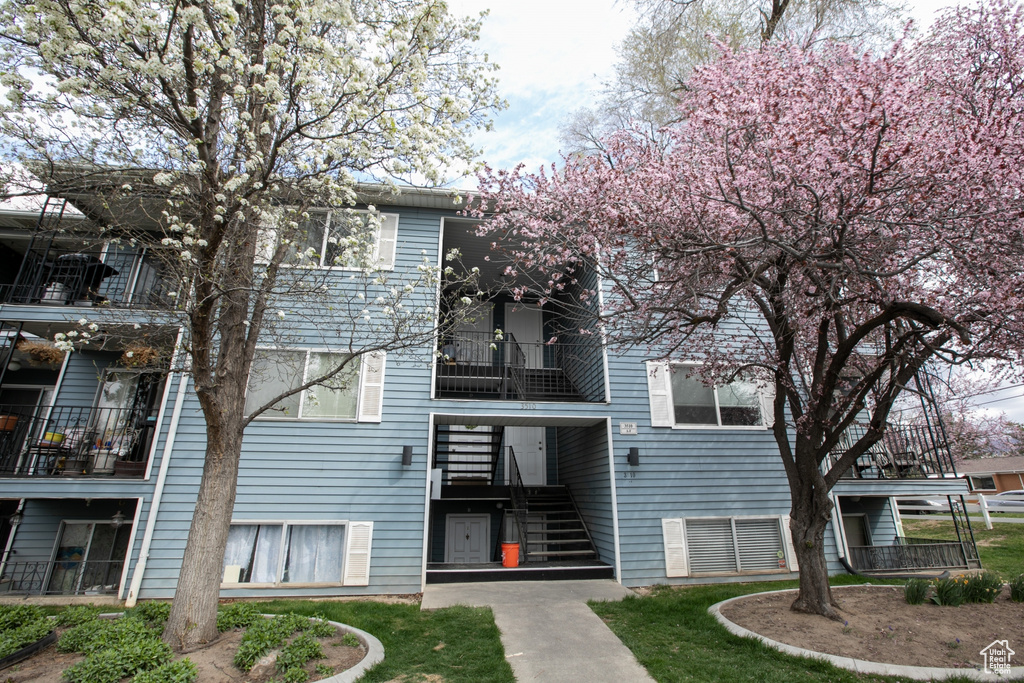 View of property featuring stairs