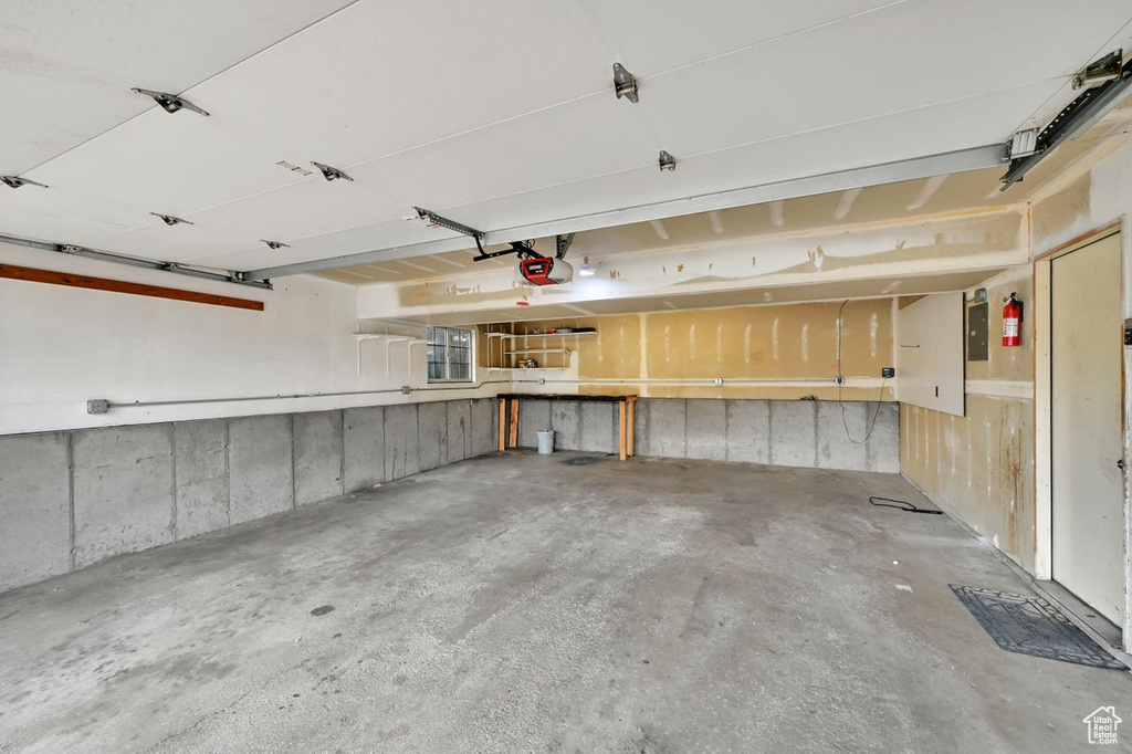 Garage featuring a garage door opener