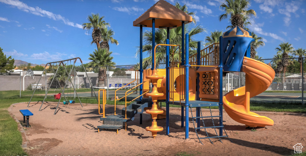 Community jungle gym featuring fence
