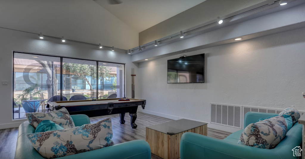 Rec room with visible vents, track lighting, wood finished floors, billiards, and vaulted ceiling