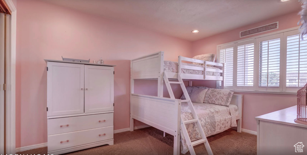Carpeted bedroom featuring baseboards and recessed lighting