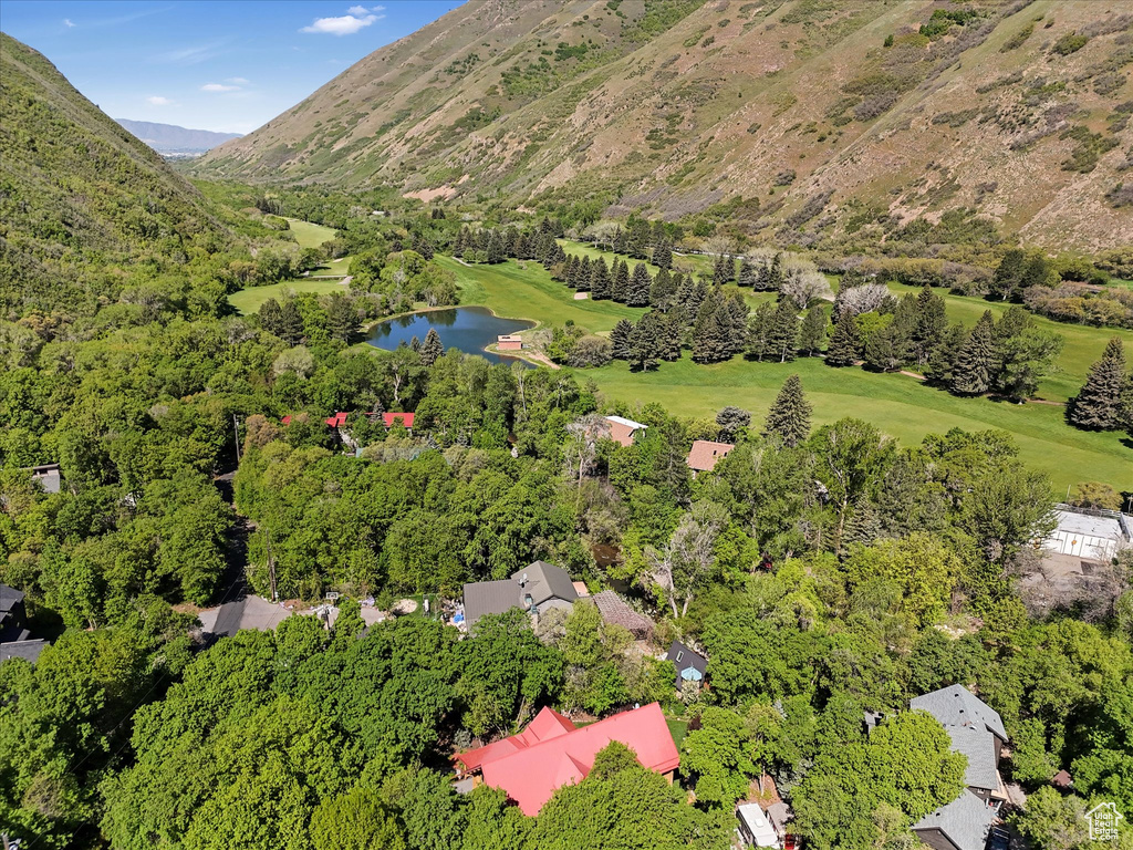 Aerial view of property and surrounding area with a large body of water
