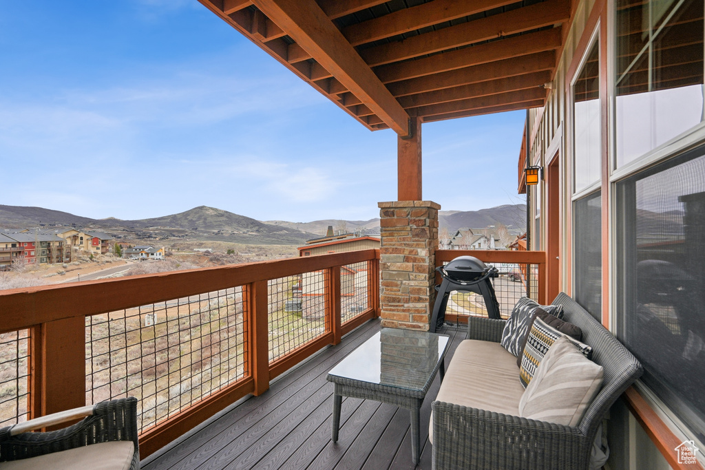 Deck with area for grilling and a mountain view
