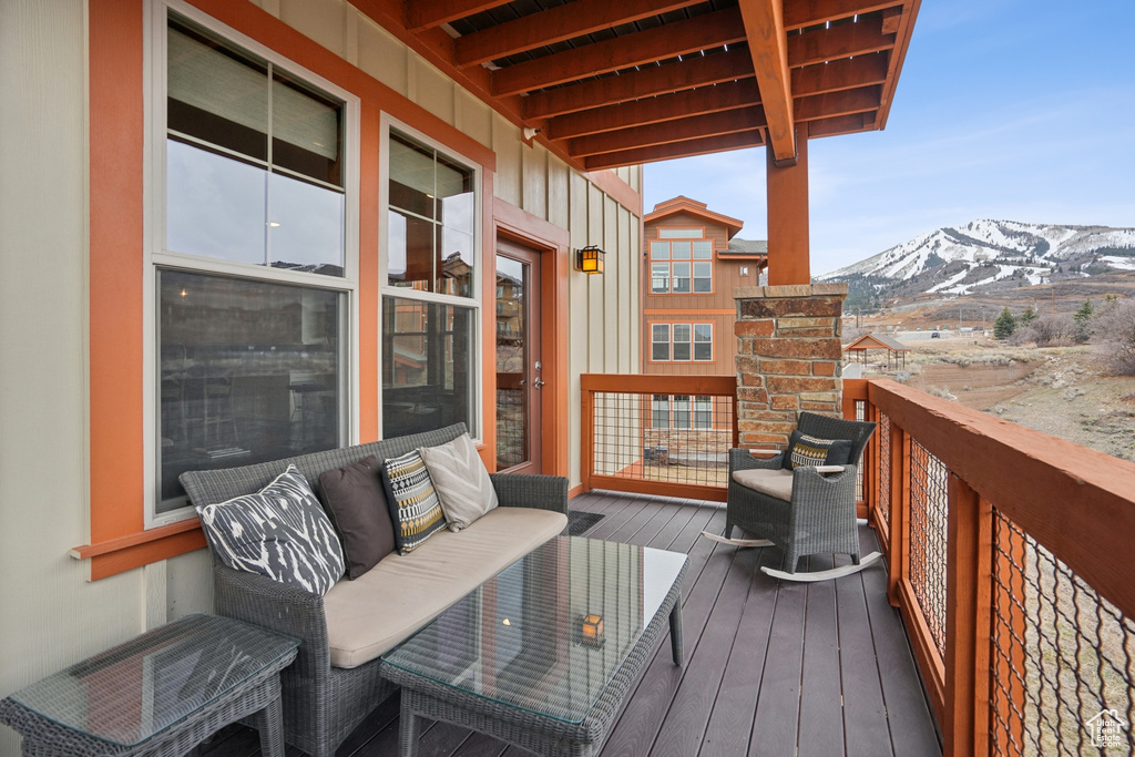 Wooden terrace featuring a mountain view