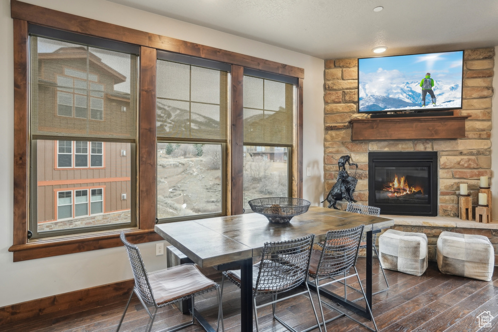 Dining area featuring a fireplace and hardwood / wood-style floors