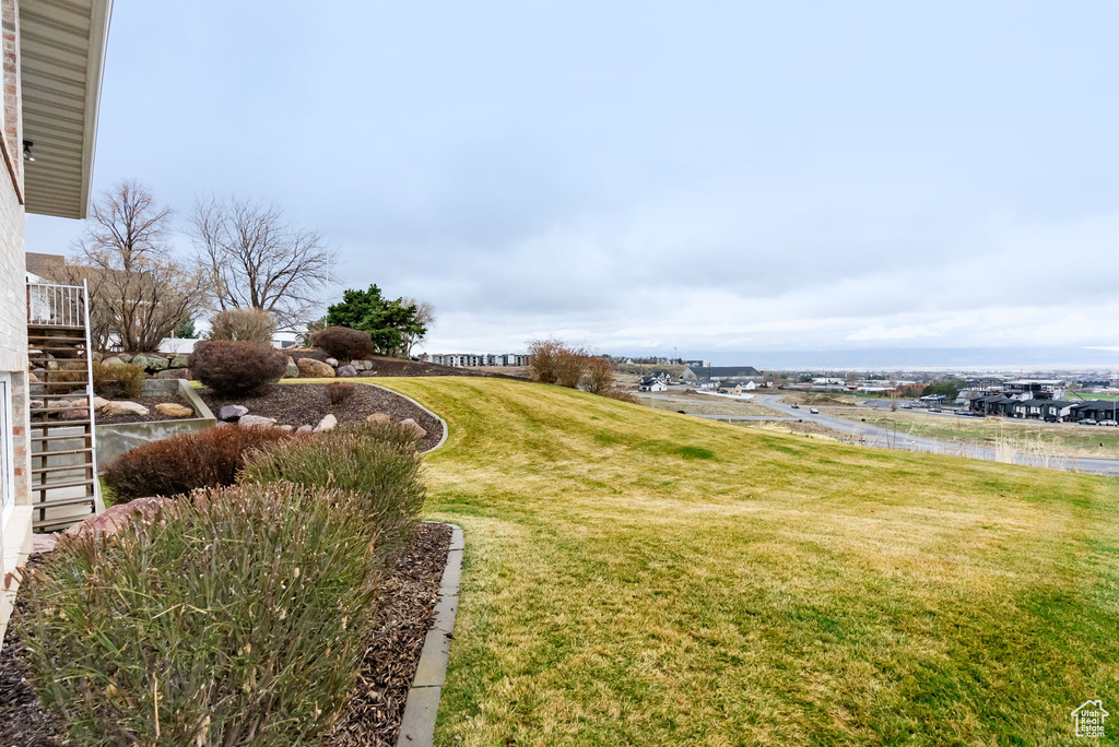 View of yard featuring stairway