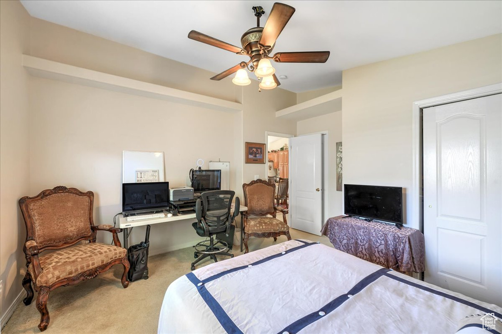 Bedroom featuring carpet and ceiling fan