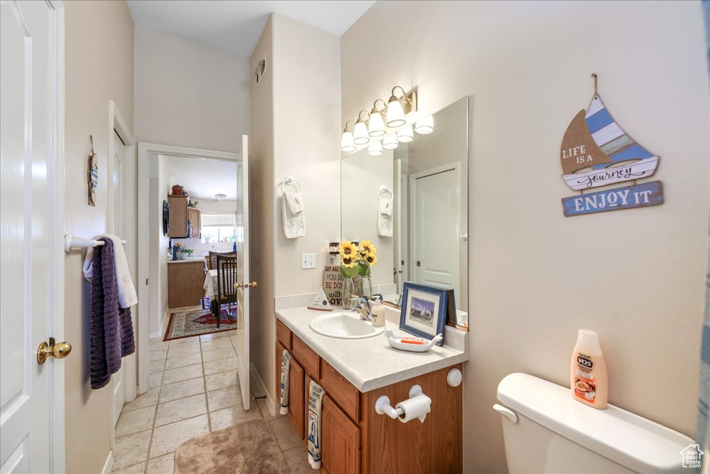Bathroom with toilet and vanity