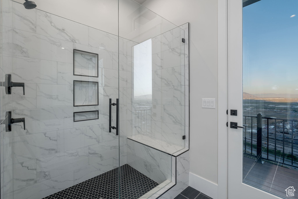 Full bathroom featuring a shower stall