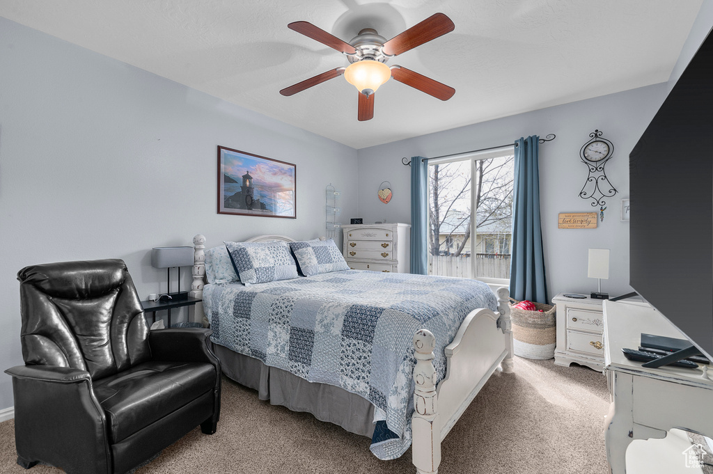 Bedroom with carpet flooring and a ceiling fan