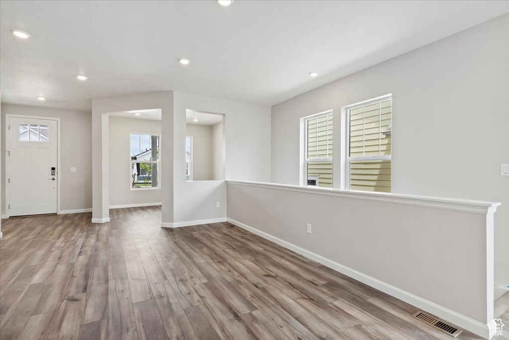 Entryway featuring wood finished floors, recessed lighting, baseboards, and visible vents
