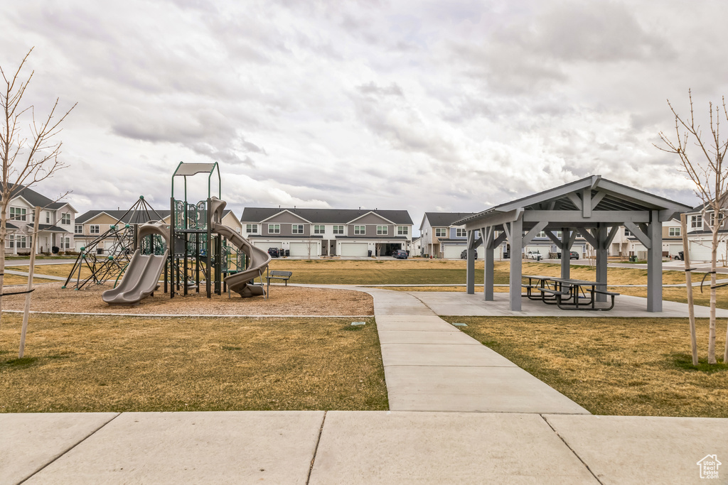 Community jungle gym with a residential view, a gazebo, and a yard