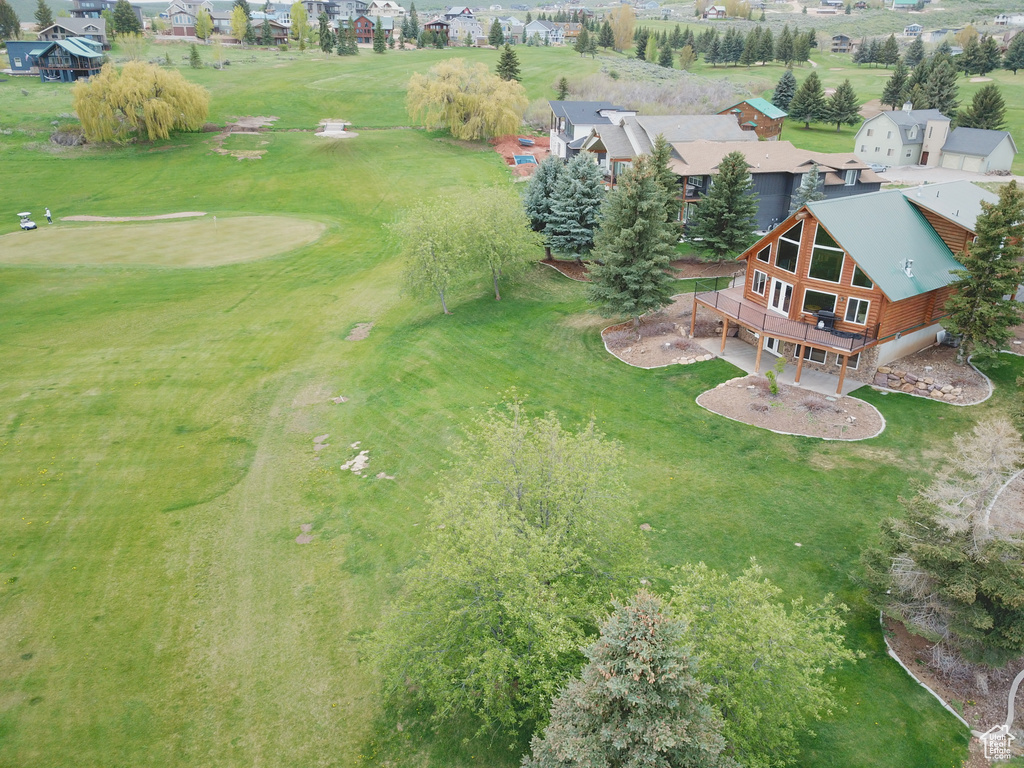 Aerial view of residential area featuring a golf course