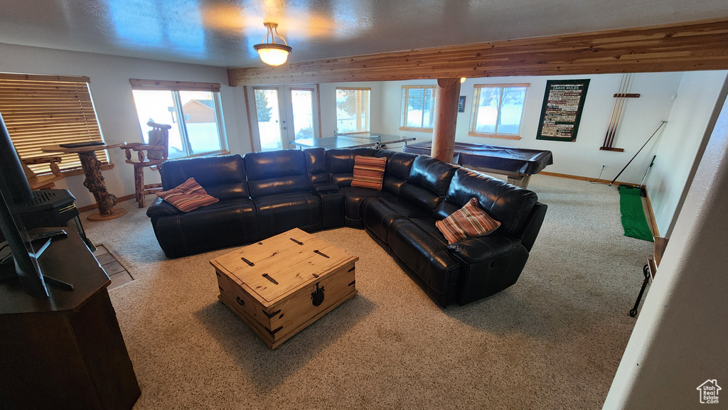 Carpeted living room featuring baseboards