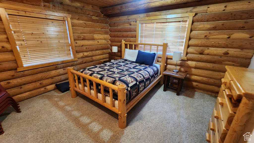 Bedroom with rustic walls