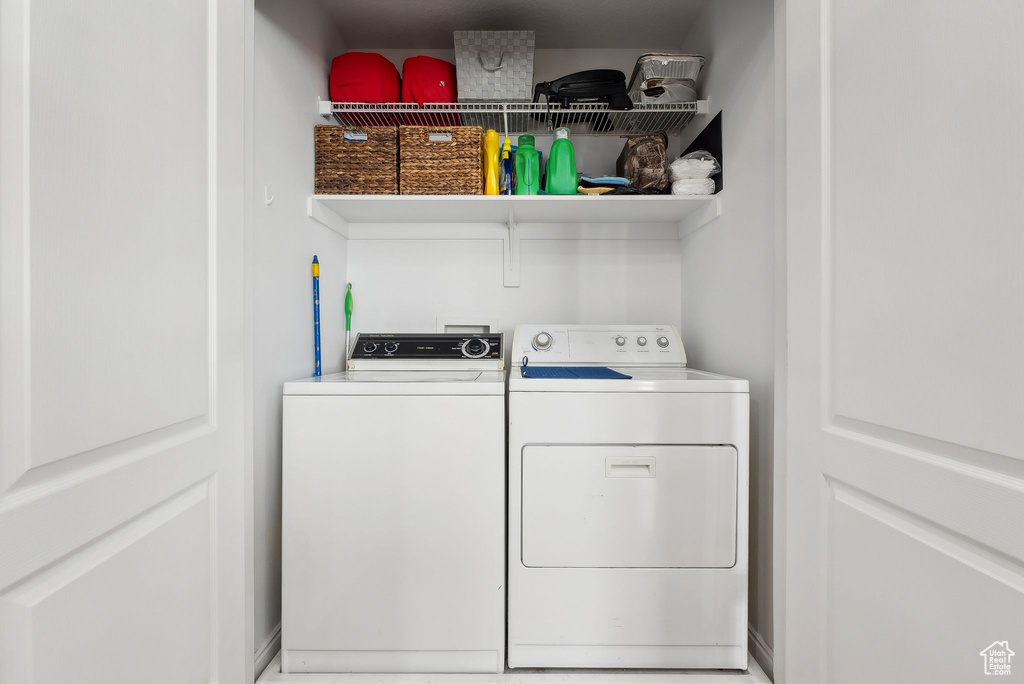 Washroom with laundry area and washer and clothes dryer