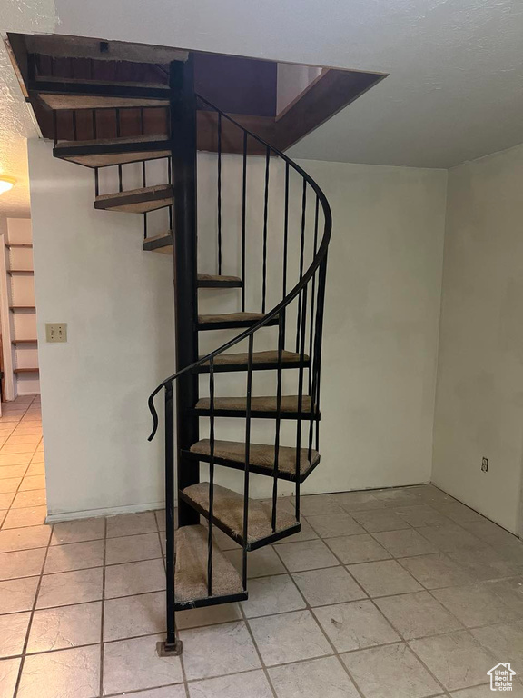 Stairway featuring tile patterned flooring