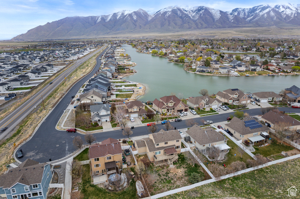 Drone / aerial view featuring a residential view and a water and mountain view