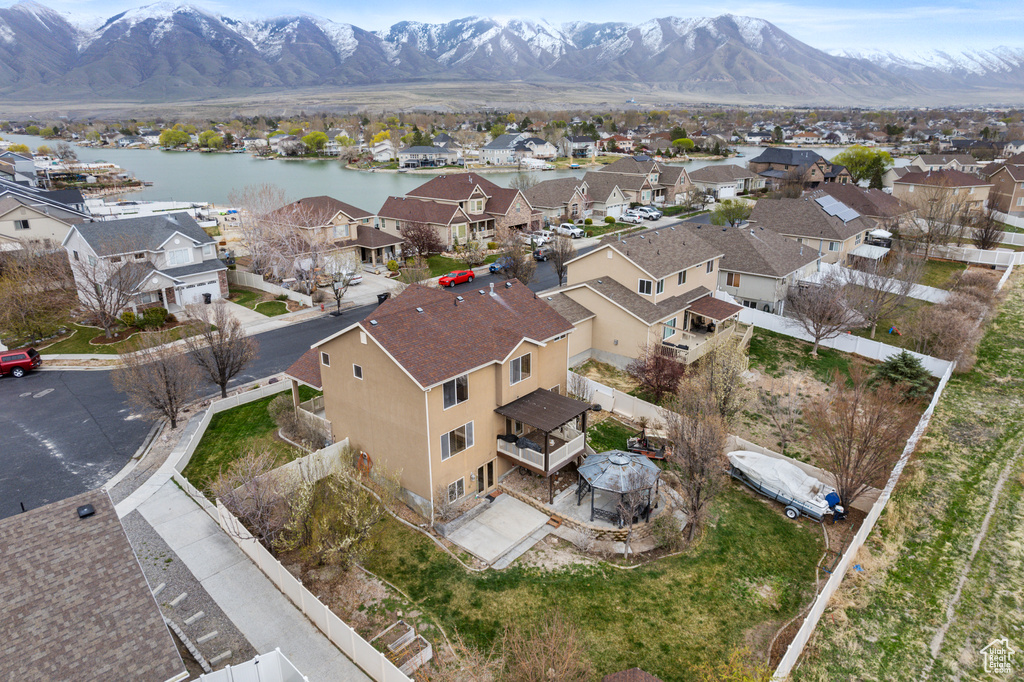 Birds eye view of property with a residential view and a water and mountain view