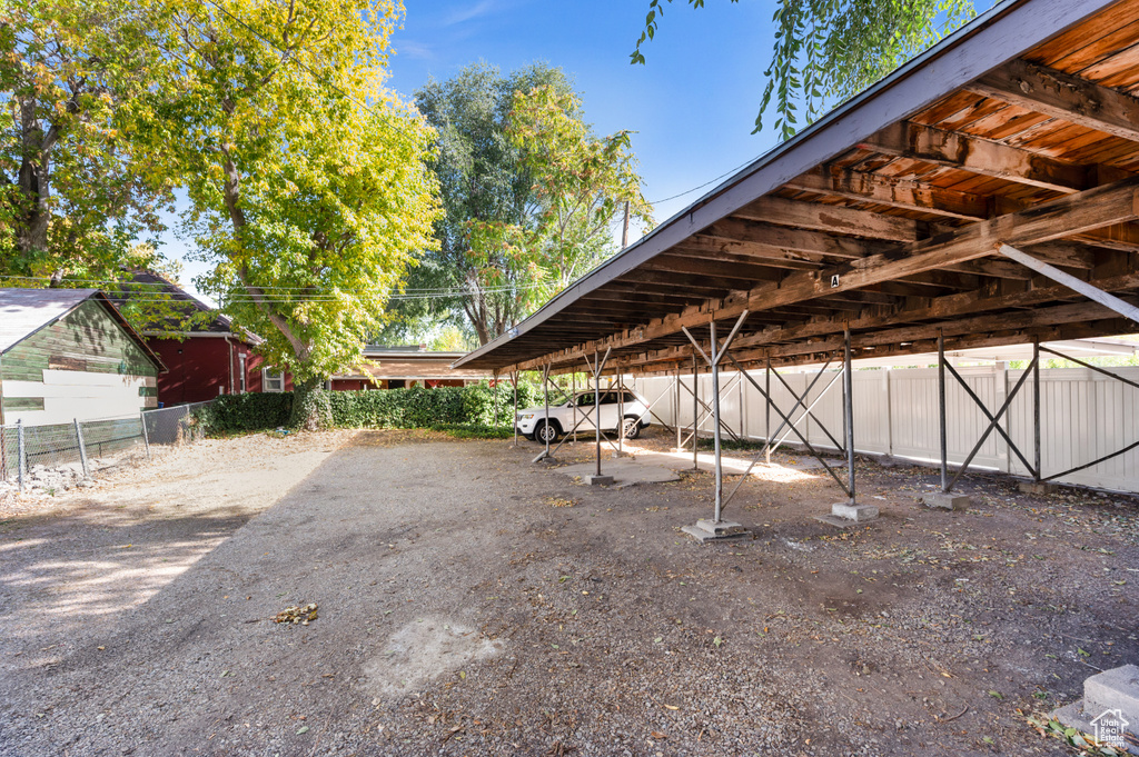 Covered parking lot with fence