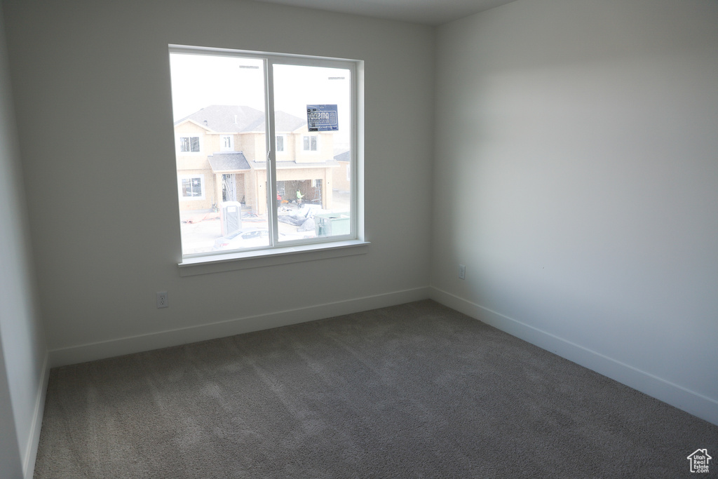 Spare room with carpet floors and baseboards