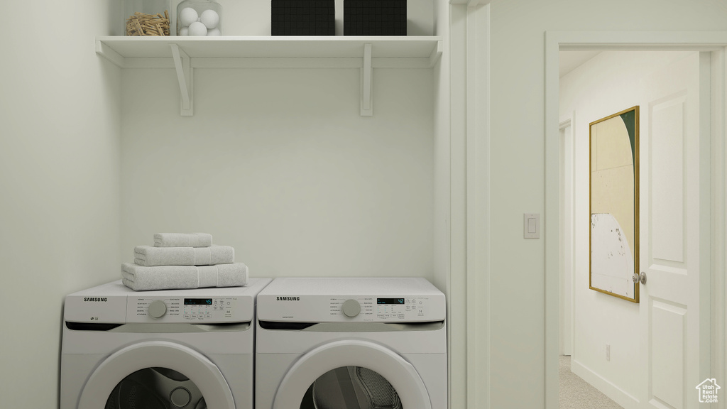 Washroom with independent washer and dryer, laundry area, carpet, and baseboards