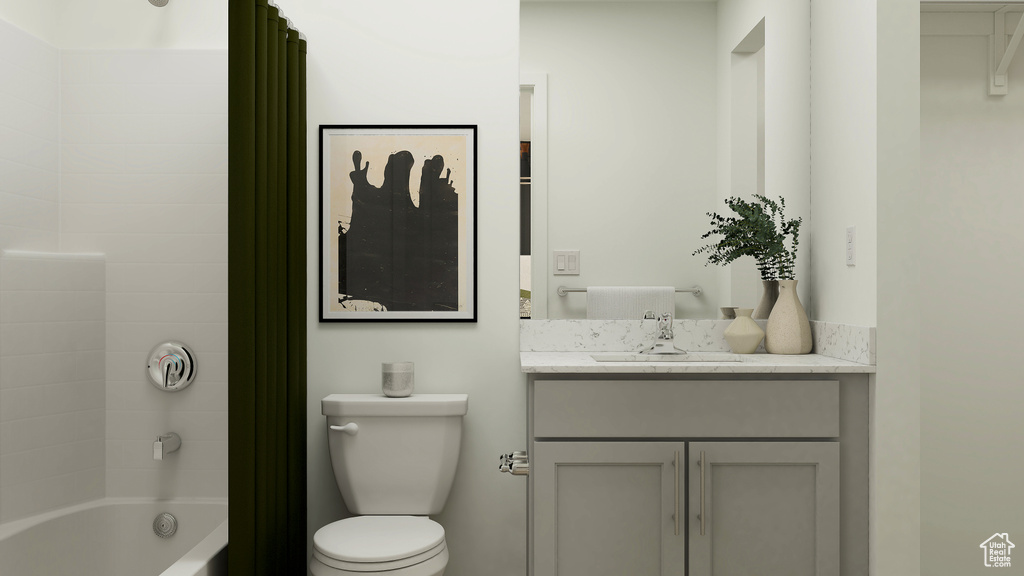 Bathroom featuring shower / tub combo with curtain, toilet, and vanity