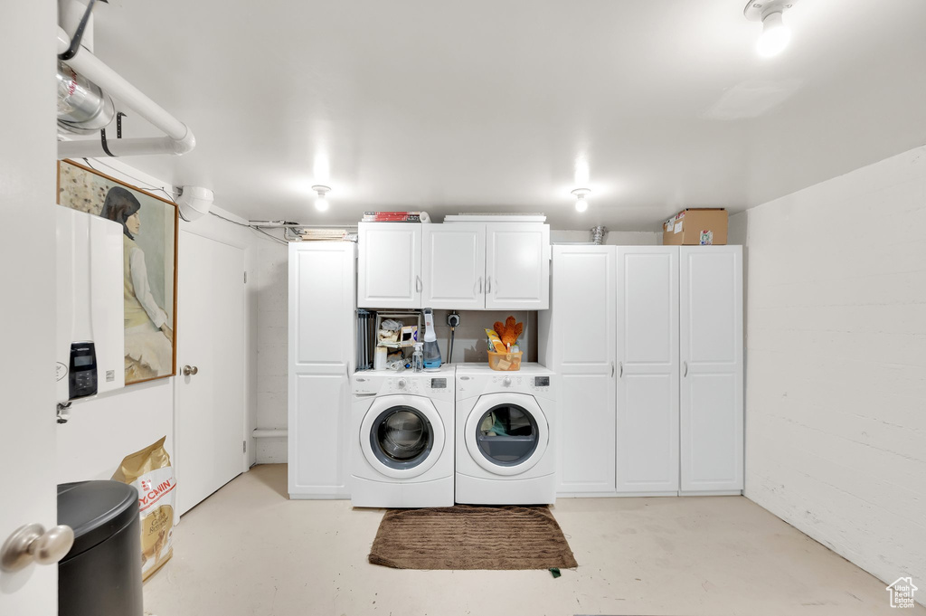 Laundry room with cabinet space and separate washer and dryer