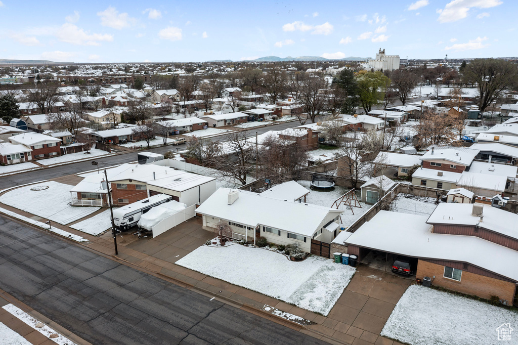 Snowy aerial view with a residential view