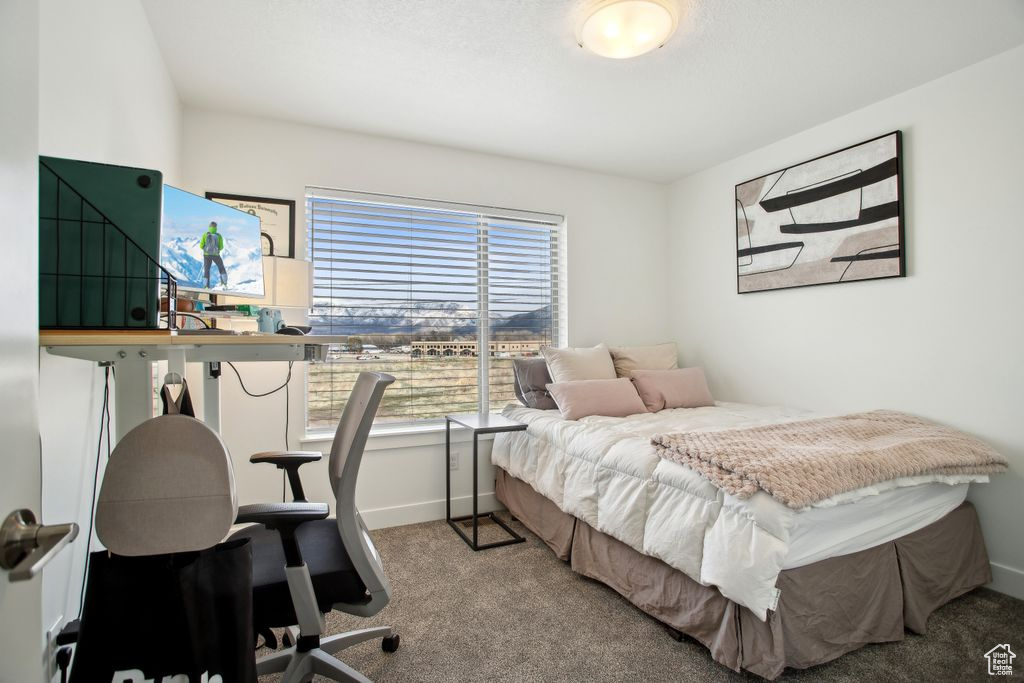 Carpeted bedroom with baseboards
