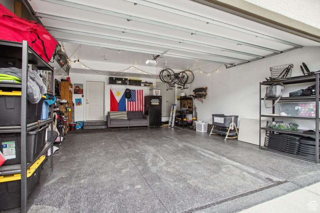 Garage with freestanding refrigerator