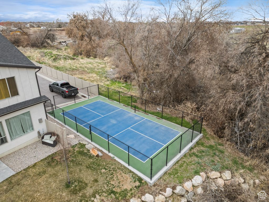 View of tennis court with fence