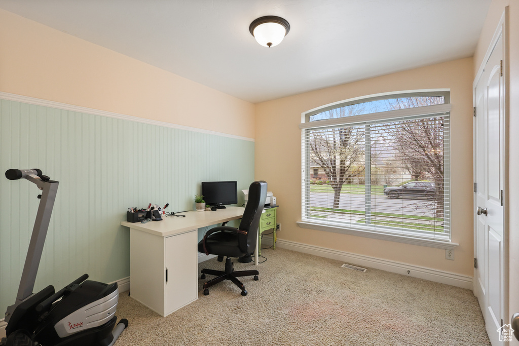 Carpeted office featuring baseboards and visible vents