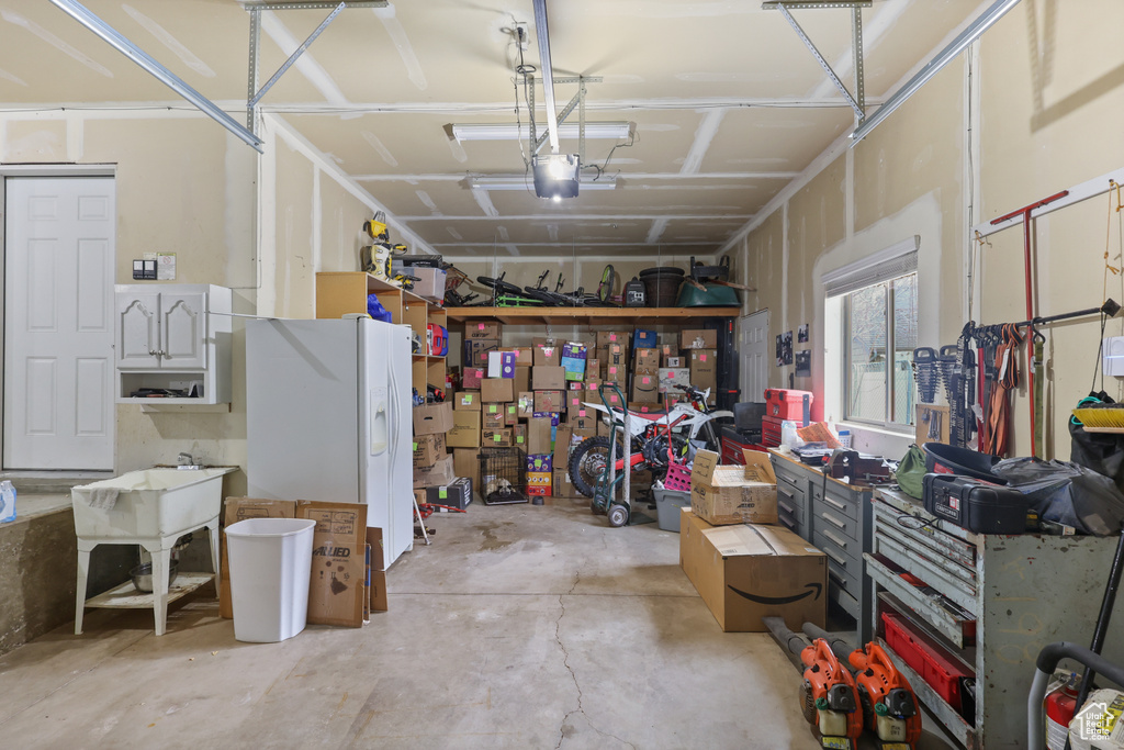 Garage featuring a garage door opener