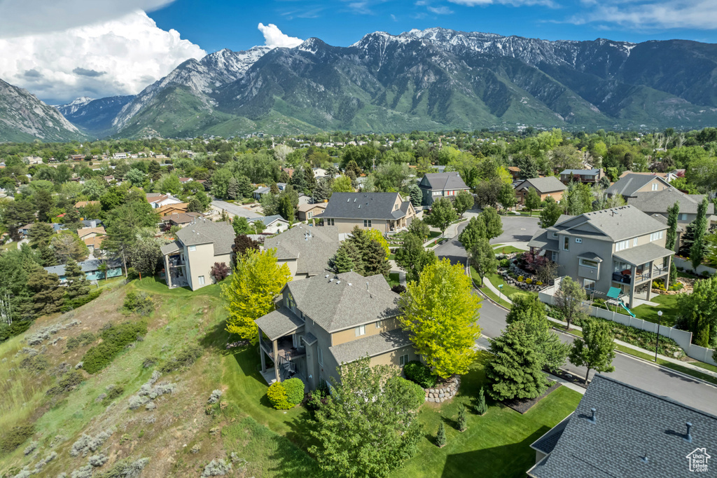 Aerial view of residential area with a mountainous background